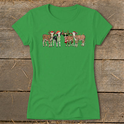 Green t-shirt with cartoon cows wearing Santa hats and Christmas lights.