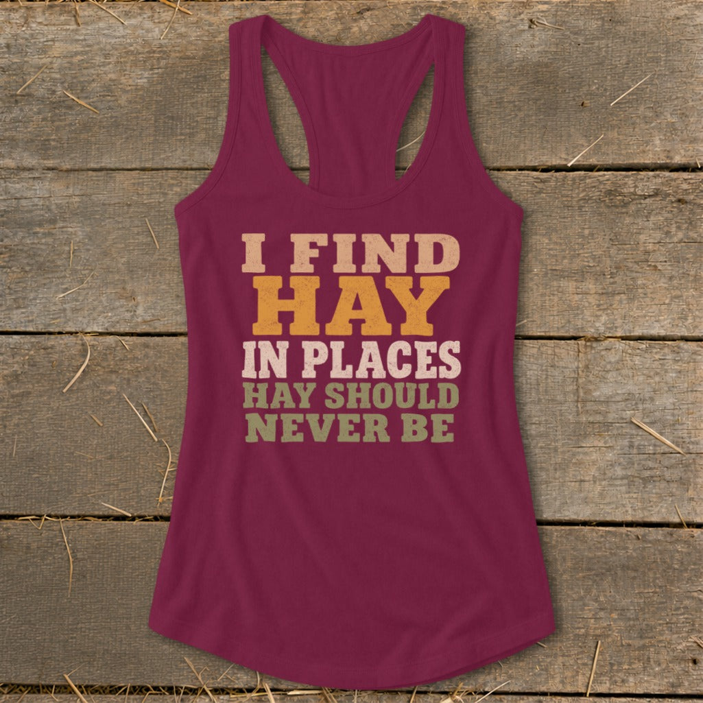 Maroon tank top with text "I FIND HAY IN PLACES HAY SHOULD NEVER BE".