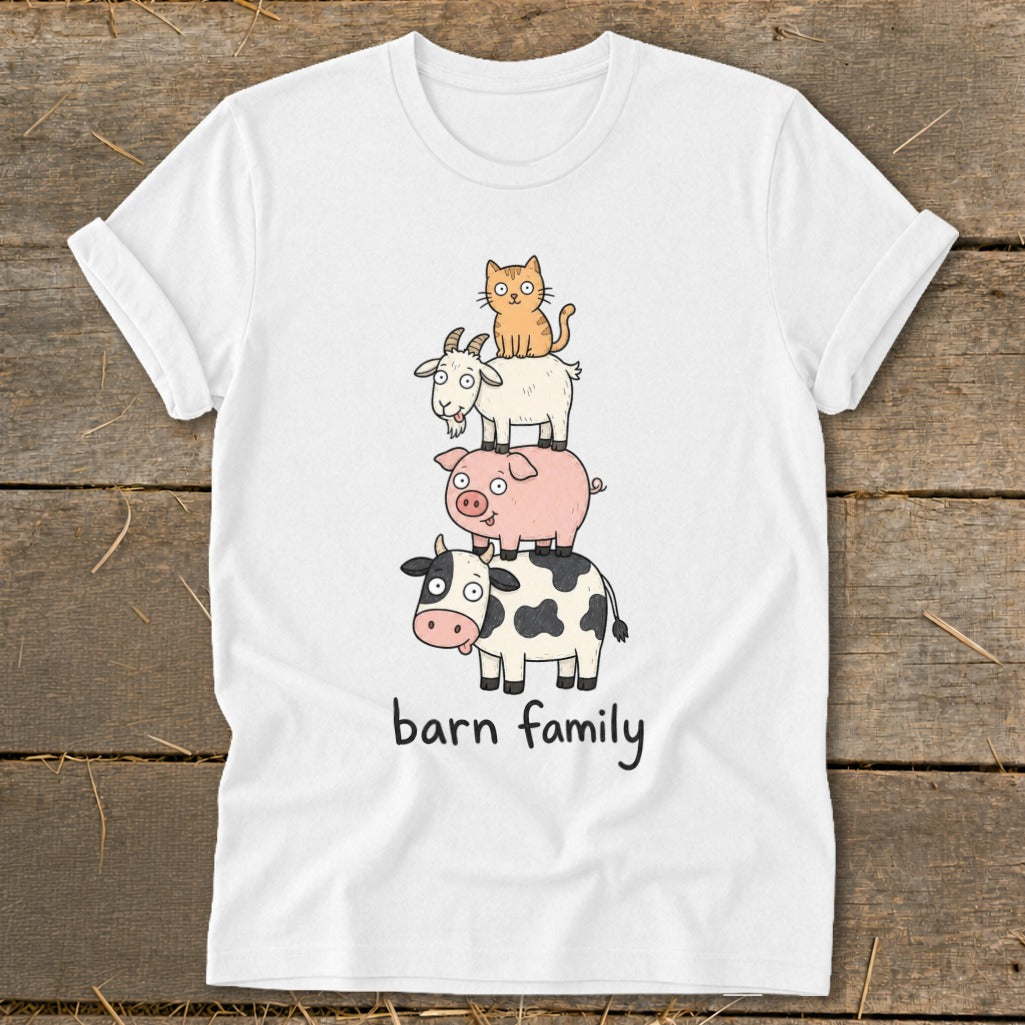 White t-shirt with stacked cartoon cow, pig, goat, and cat illustration and "barn family" text.