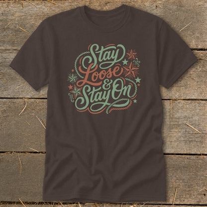Brown t-shirt with "Stay Loose & Stay On" graphic in pastel colors.
