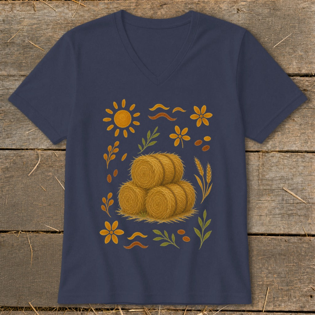 Navy v-neck t-shirt with stacked hay bales, sun, flowers, and leaves graphic.