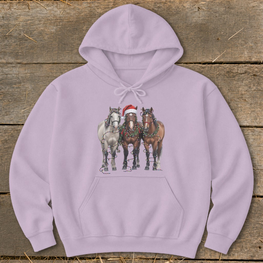 Three horses wearing Christmas lights and a Santa hat on a purple hoodie.