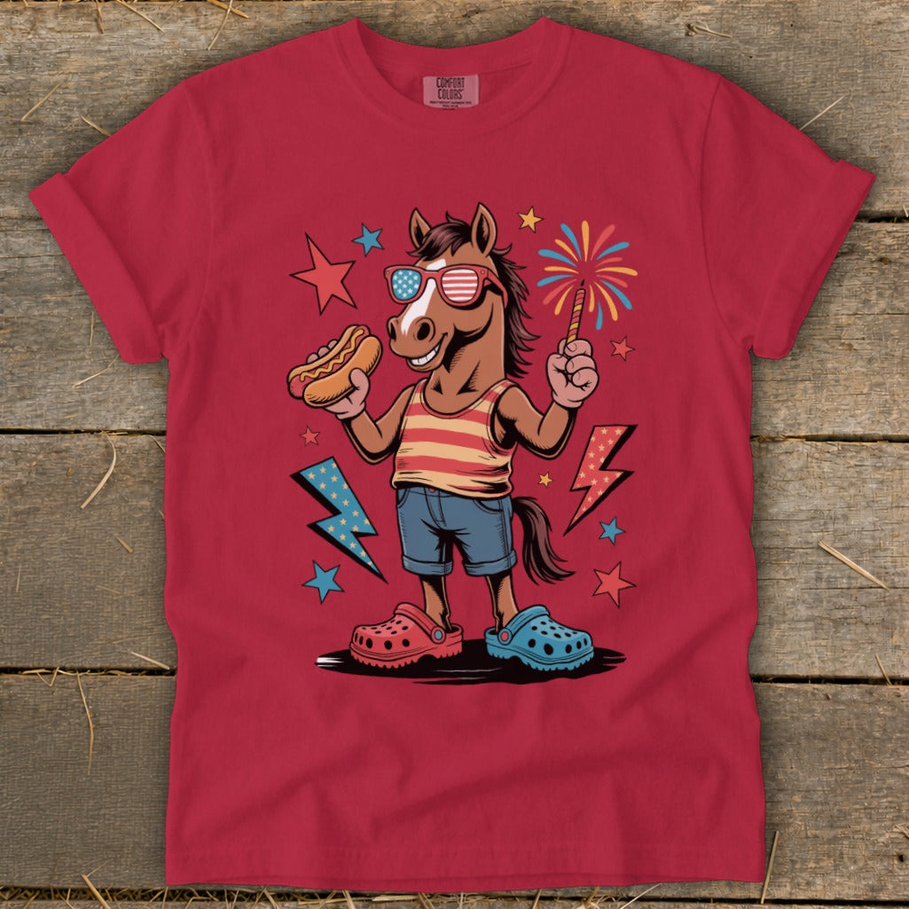 Cartoon horse wearing sunglasses holding hot dog and sparkler.