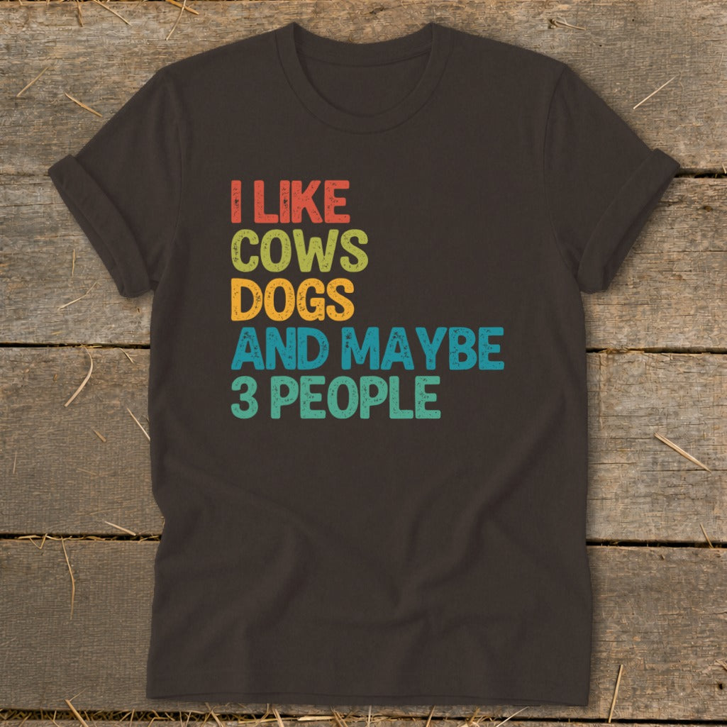 Dark t-shirt with text "I like cows dogs and maybe 3 people".