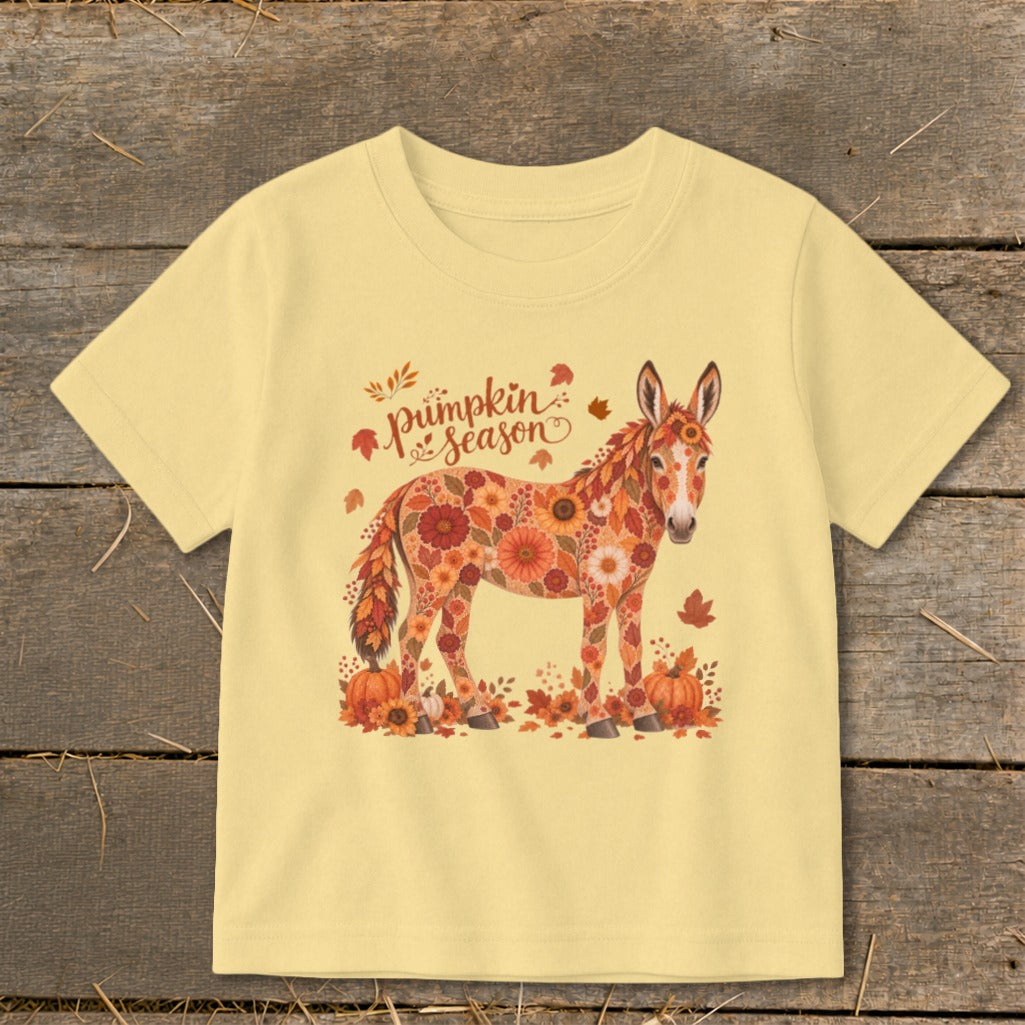 Yellow t-shirt with a floral donkey, pumpkins, and "pumpkin season" text.