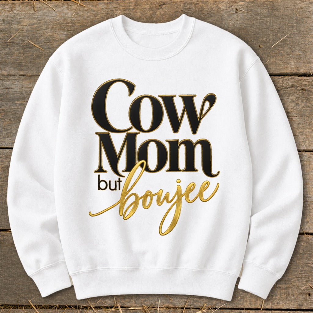 White sweatshirt with "Cow Mom but boujee" text.