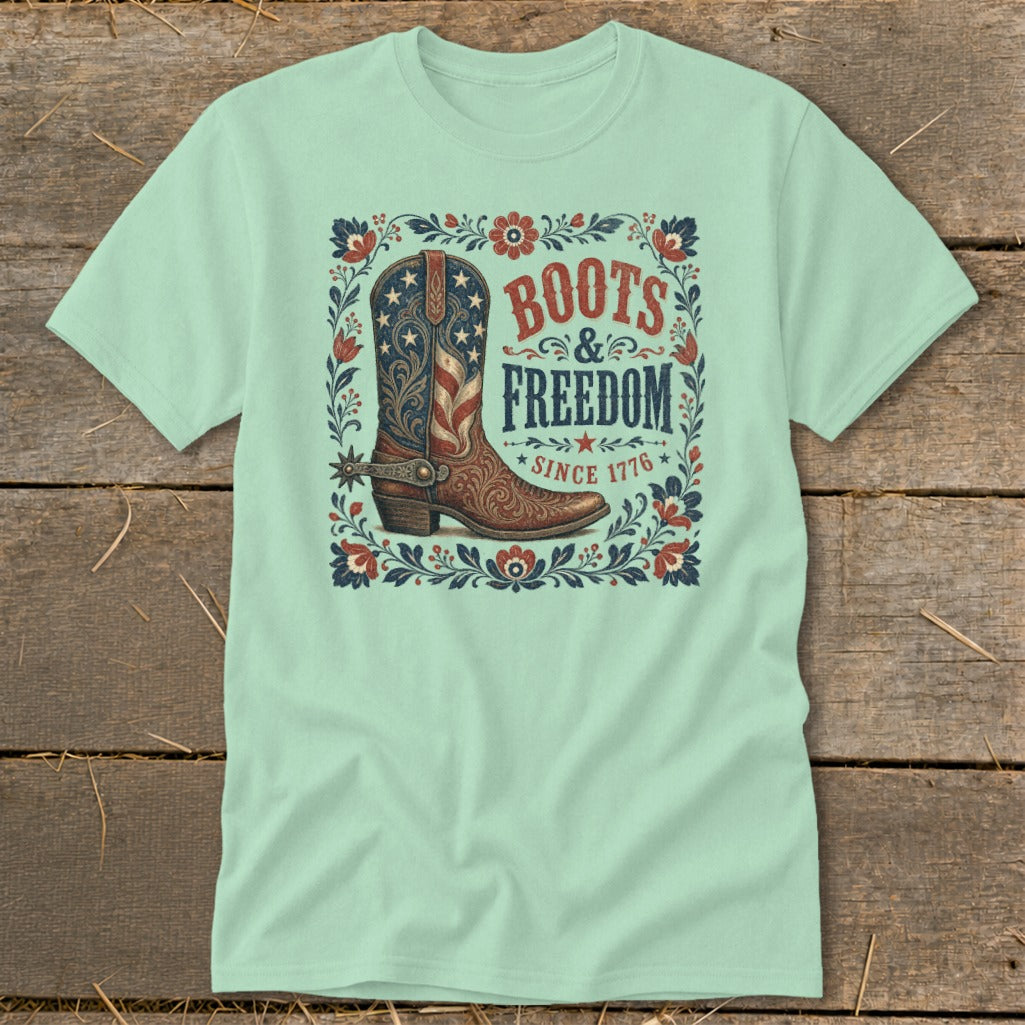 Light blue t-shirt with patriotic boot and "Boots & Freedom Since 1776" text.