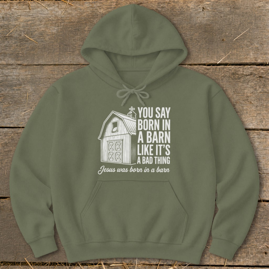 Olive hoodie with text "You say born in a barn like it's a bad thing" and barn graphic.