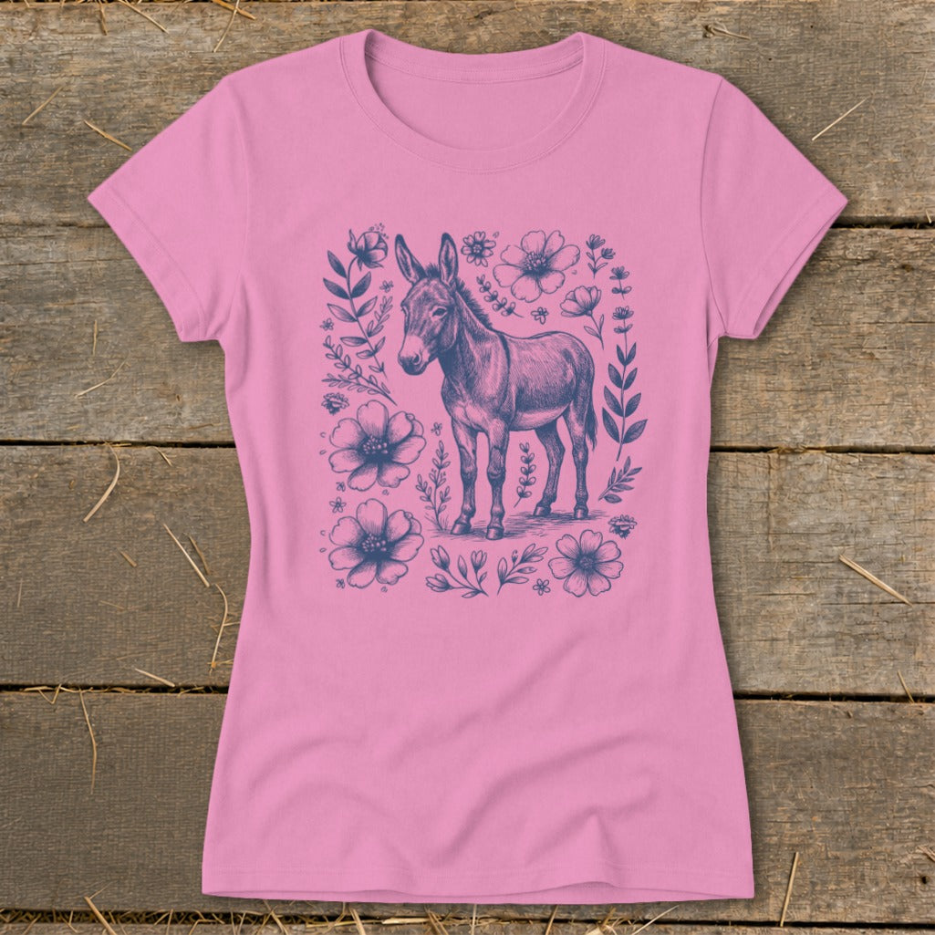 Pink t-shirt with a detailed sketch of a donkey surrounded by blue flowers and leaves.