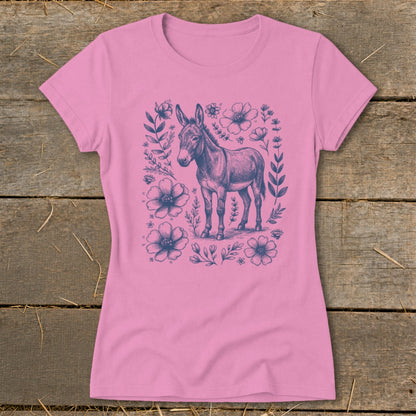 Pink t-shirt with a detailed sketch of a donkey surrounded by blue flowers and leaves.