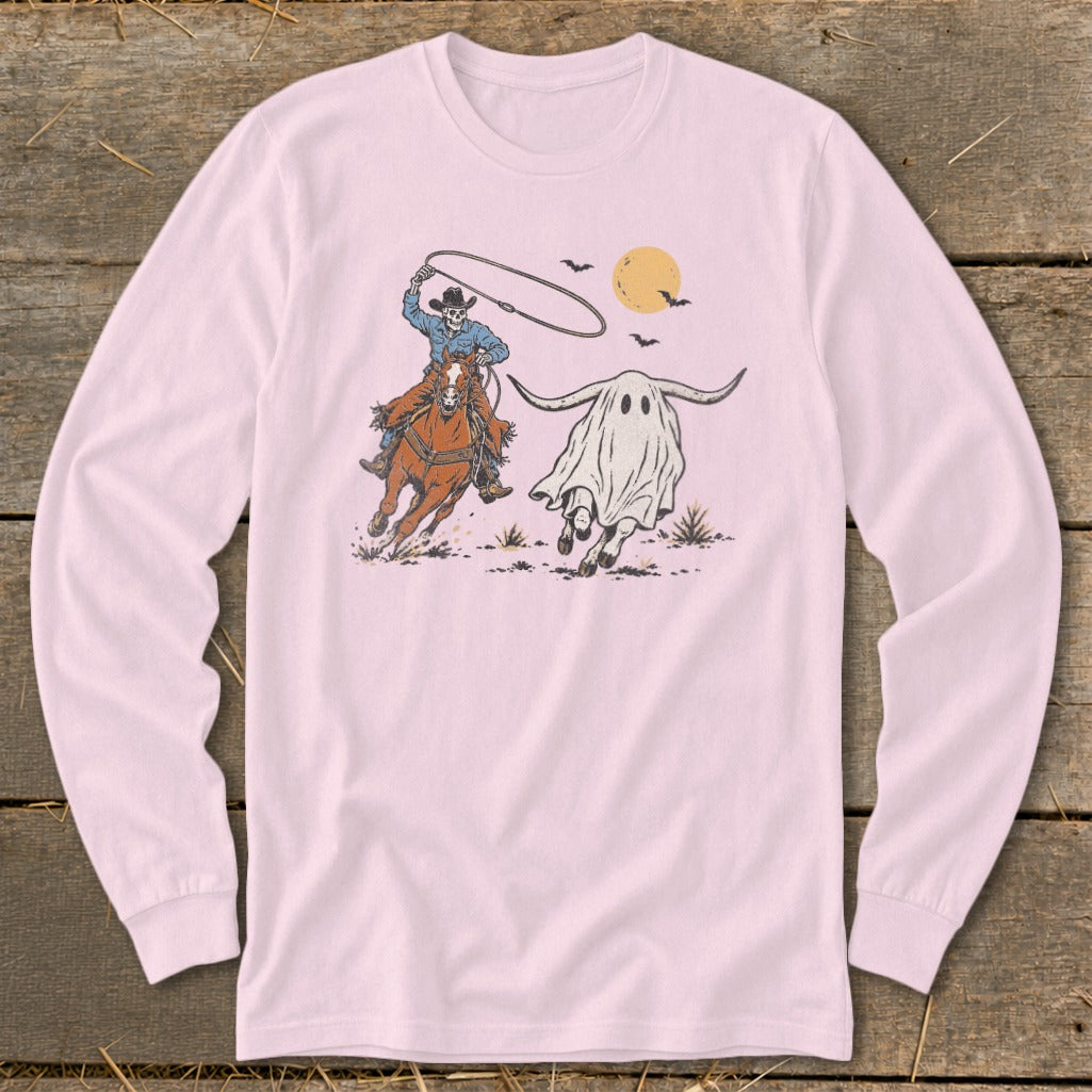 Skeleton cowboy on horse lassoing a ghost longhorn under a full moon.