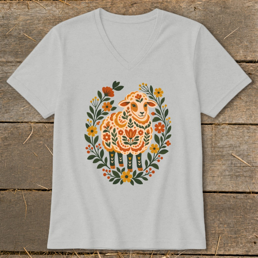 Light gray v-neck t-shirt with folk art sheep surrounded by floral wreath.
