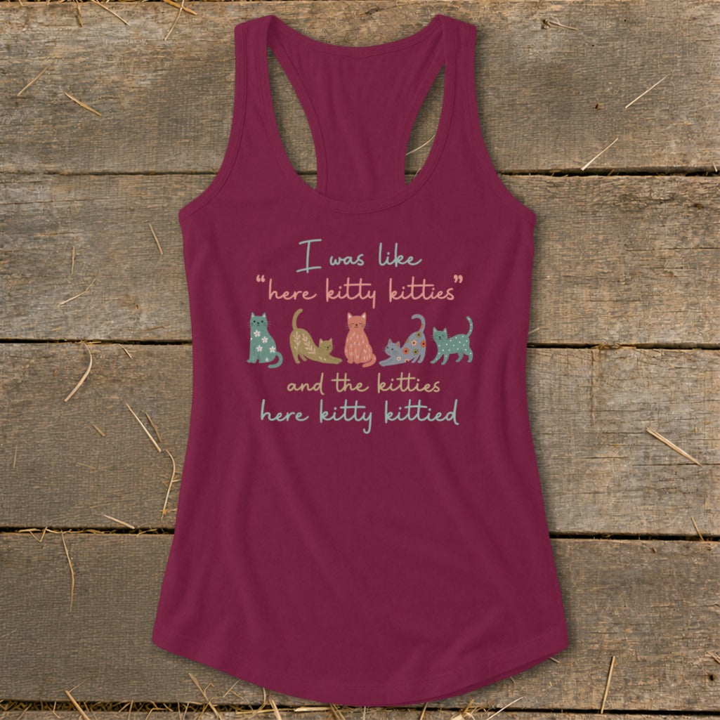 Maroon tank top with "I was like 'here kitty kitties' and the kitties here kitty kittied" and cat illustrations.