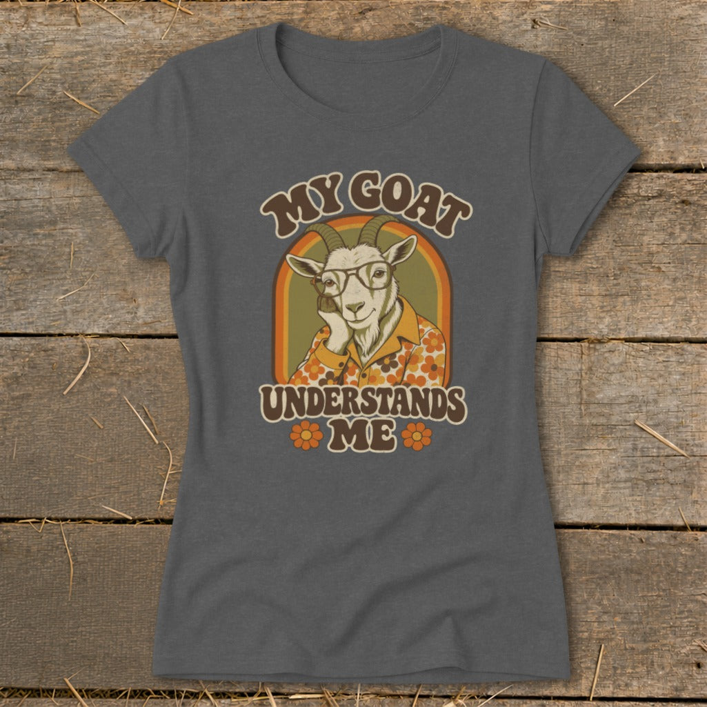 A dark gray t-shirt featuring a retro graphic of a goat in glasses, with the text MY GOAT UNDERSTANDS ME.