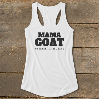 White racerback tank top with black text "MAMA GOAT GREATEST OF ALL TIME".