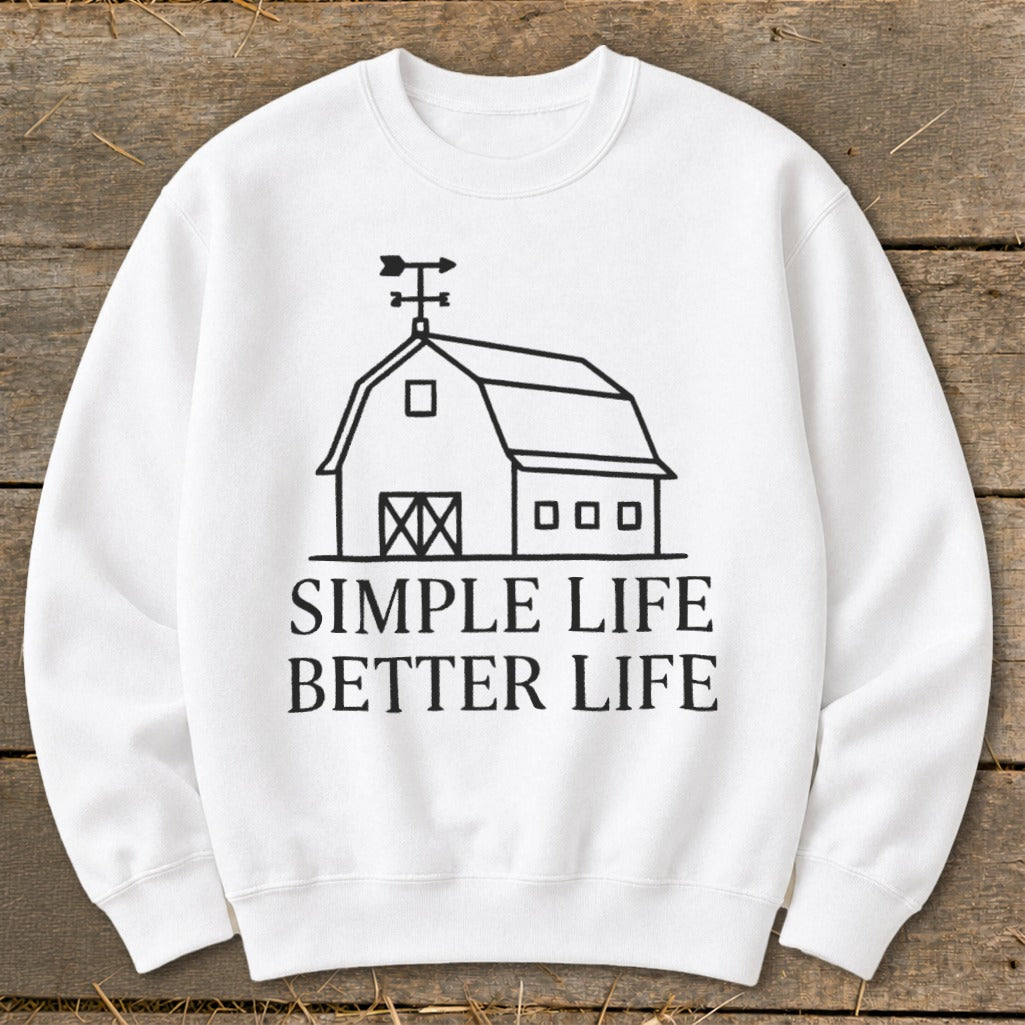 White sweatshirt with black graphic of barn and text "SIMPLE LIFE BETTER LIFE."
