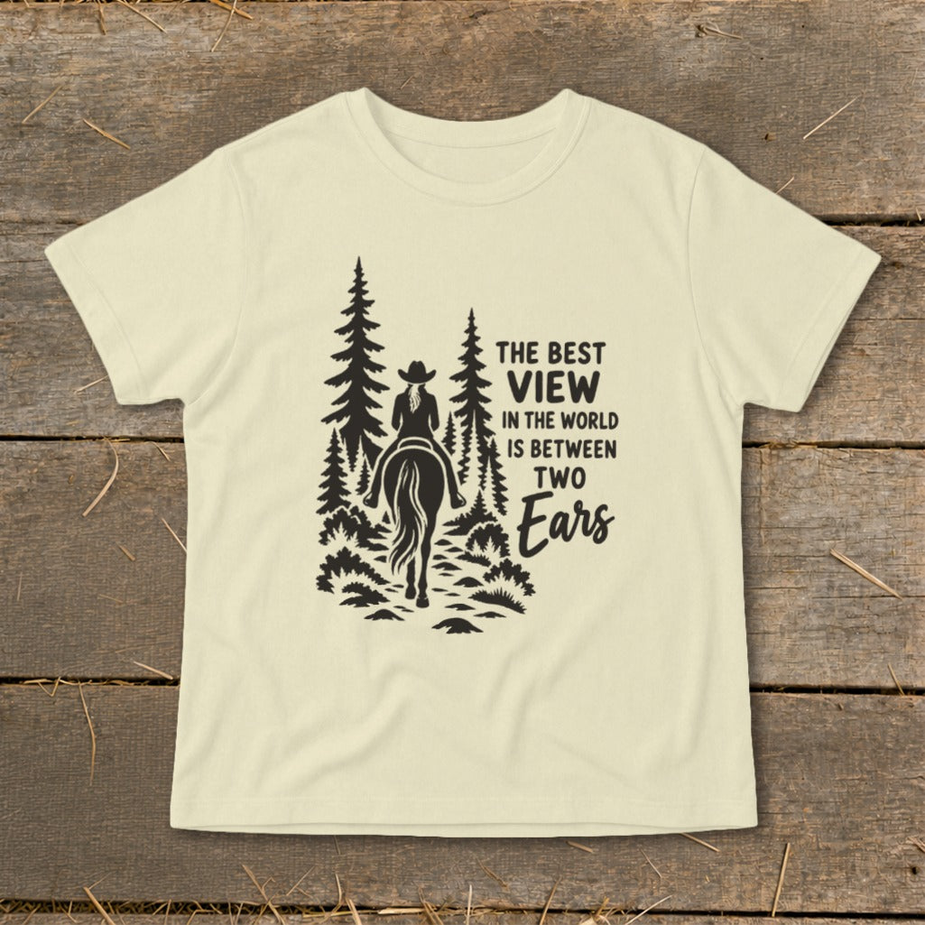 Light cream t-shirt featuring a black graphic of a horseback rider among trees and text.
