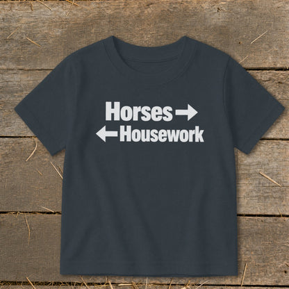 Dark gray t-shirt with white text that reads Horses with a right arrow and Housework with a left arrow.
