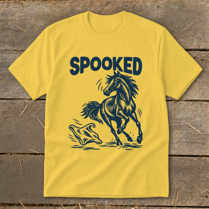 Yellow t-shirt with navy blue "SPOOKED" text and a galloping horse near a ghost.