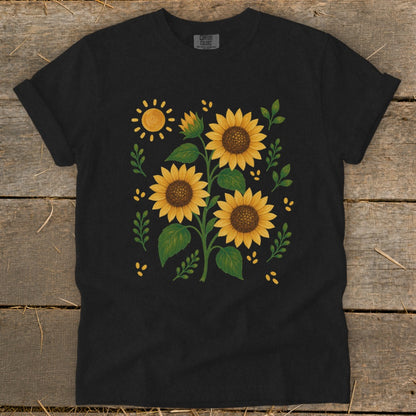 Black t-shirt with a central design of sunflowers and a sun.