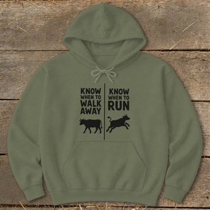 Olive green hoodie with "Know When to Walk Away" and "Know When to Run" text and cow graphics.