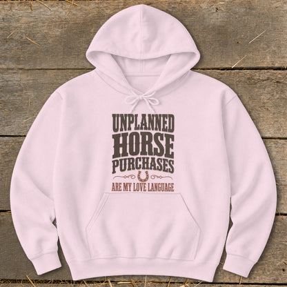 Pink hoodie with text "Unplanned Horse Purchases Are My Love Language."