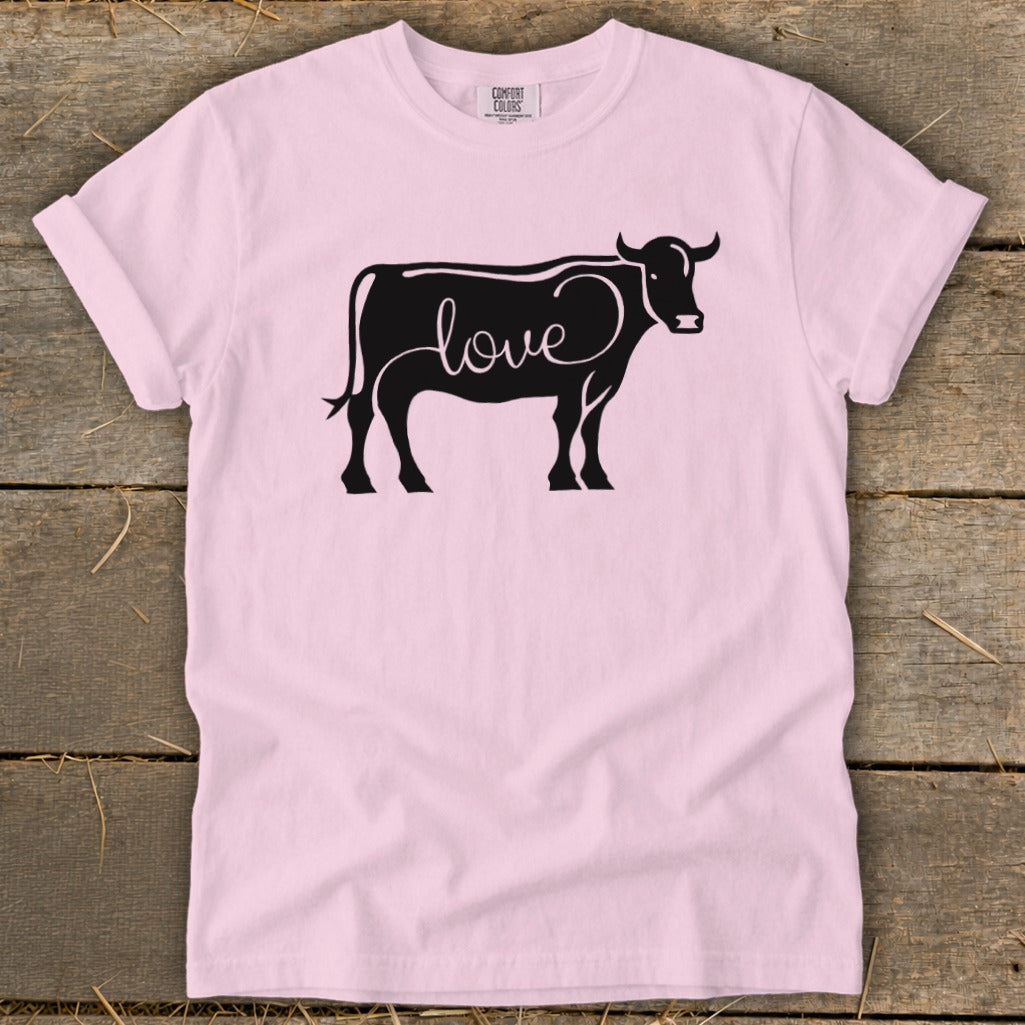 Black cow silhouette with the word "love" creatively integrated into its body.