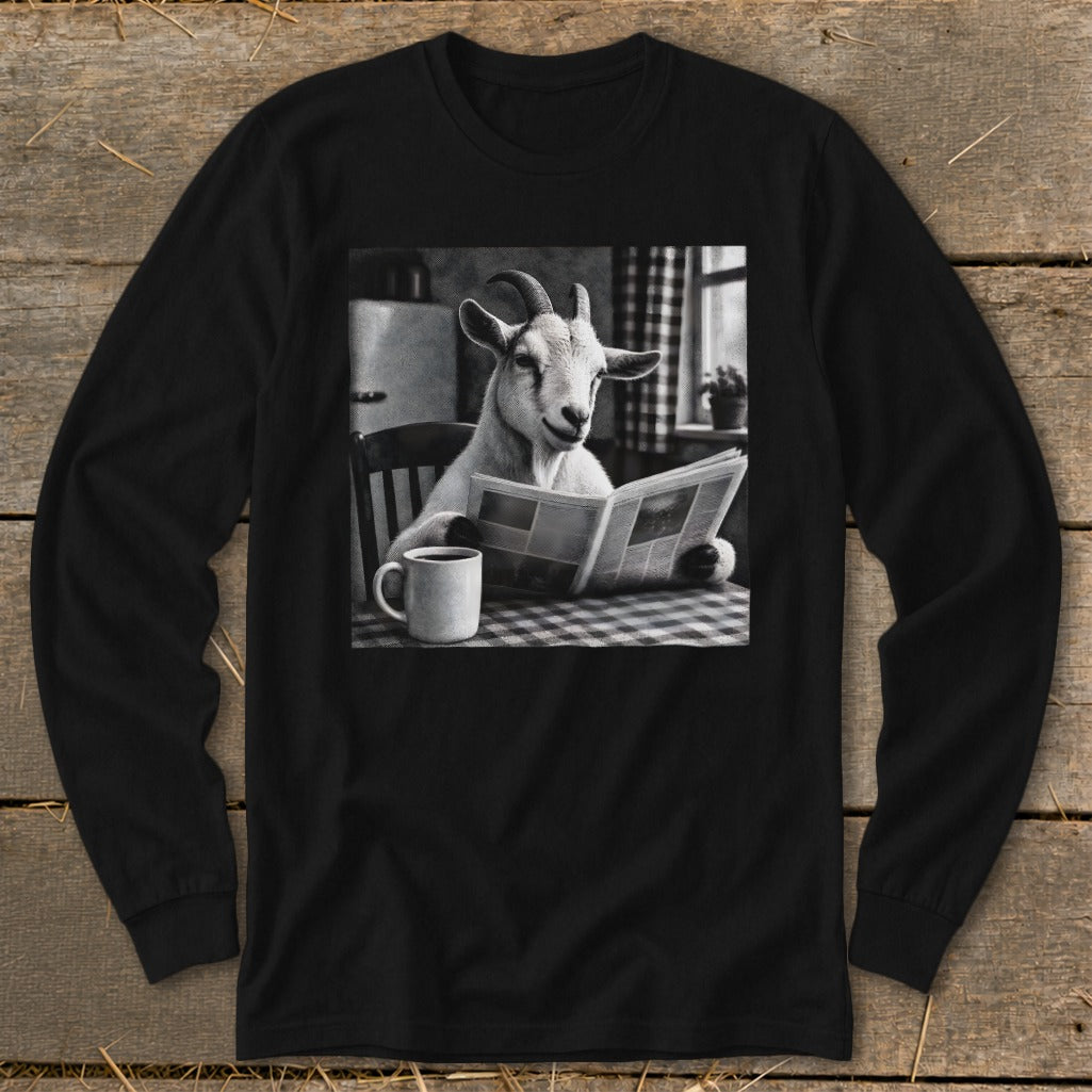 Black long-sleeve shirt featuring a black-and-white graphic of a goat sitting at a table reading a newspaper beside a coffee mug.