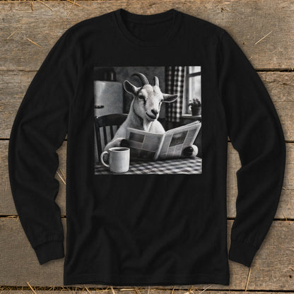 Black long-sleeve shirt featuring a black-and-white graphic of a goat sitting at a table reading a newspaper beside a coffee mug.