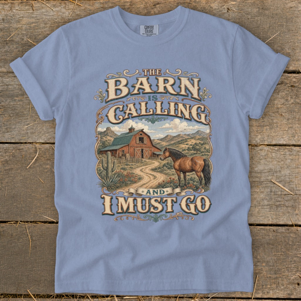 Light blue t-shirt with "The Barn Is Calling And I Must Go" graphic and barn scene.