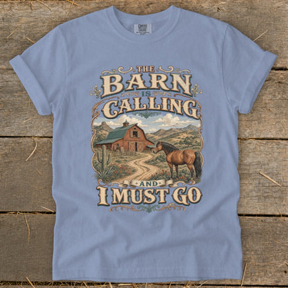 Light blue t-shirt with "The Barn Is Calling And I Must Go" graphic and barn scene.