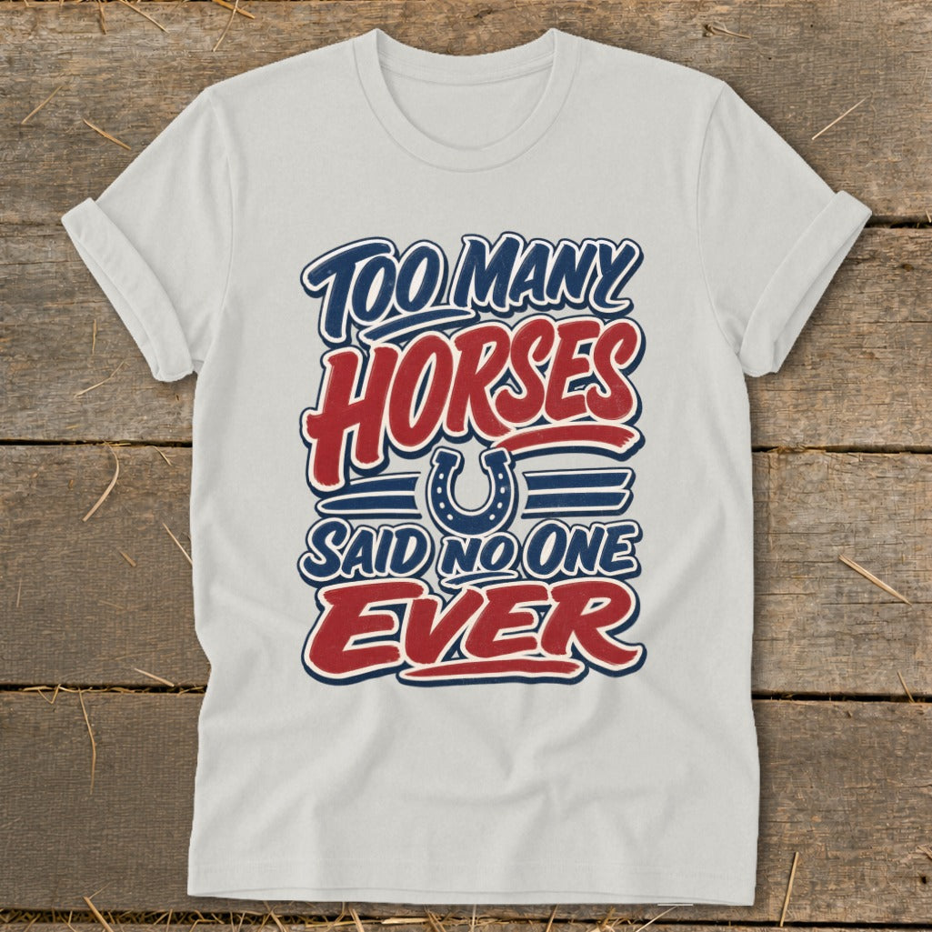 White t-shirt with "Too Many Horses Said No One Ever" text and horseshoe graphic.