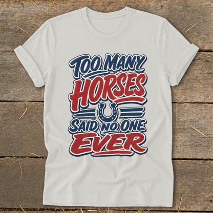 White t-shirt with "Too Many Horses Said No One Ever" text and horseshoe graphic.