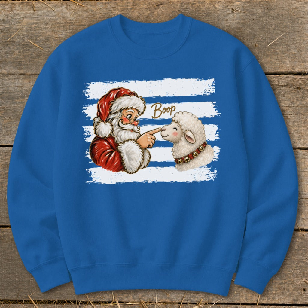 Santa booping a sheep with the word "Boop" above on a blue sweatshirt.