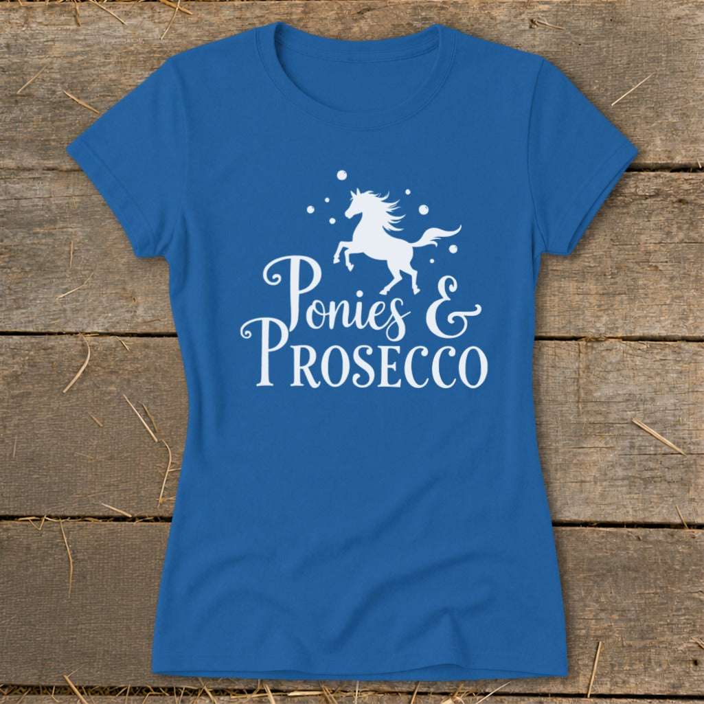 Blue t-shirt with white graphic of a pony and text "Ponies & Prosecco".