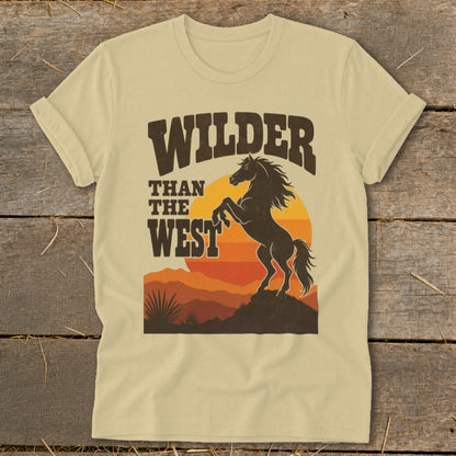 Tan t-shirt with "WILDER THAN THE WEST" text and rearing horse graphic.