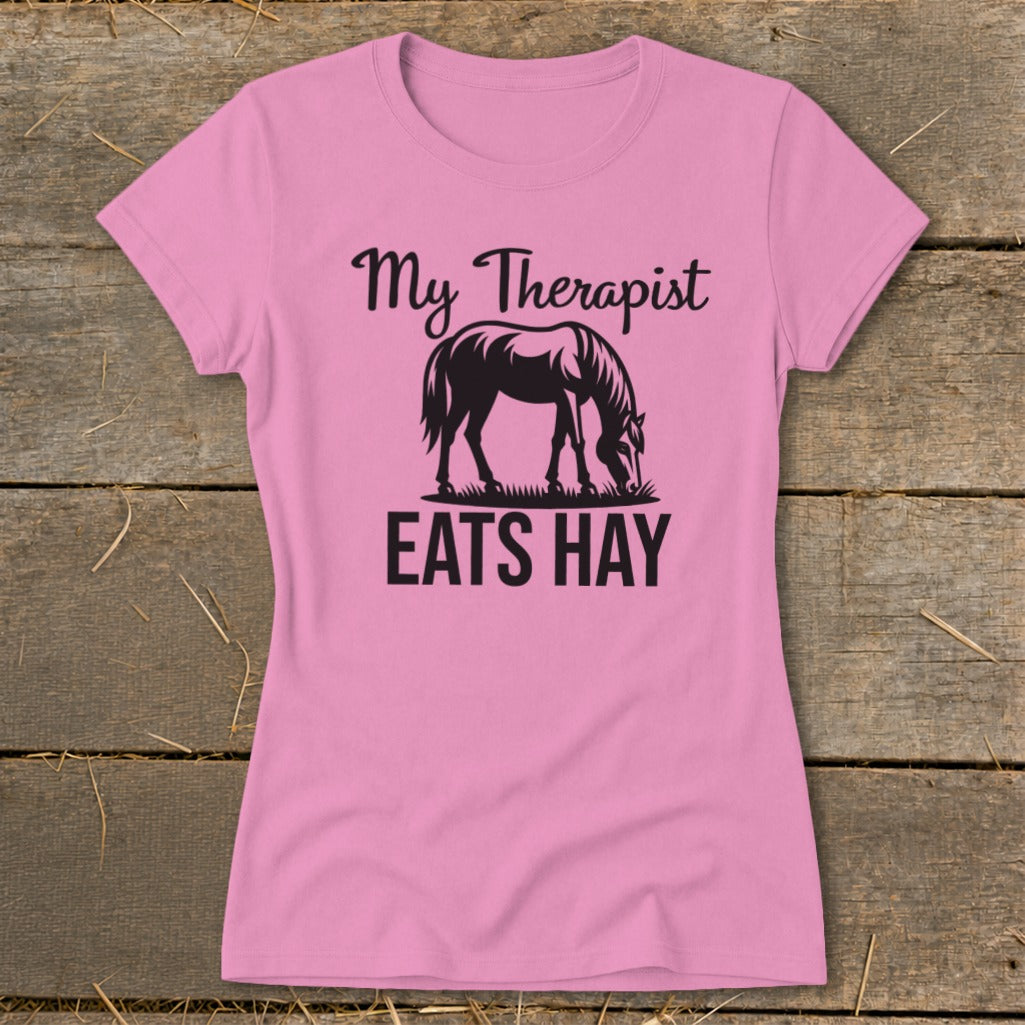 Pink t-shirt with "My Therapist Eats Hay" text and horse silhouette.
