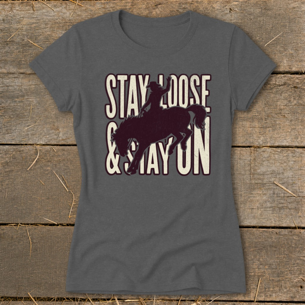 Graphic tee with "Stay Loose & Stay On" text and bucking bronco silhouette.