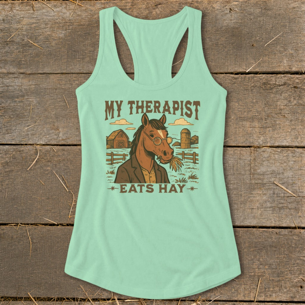 Mint tank top with graphic "MY THERAPIST EATS HAY" featuring a horse in glasses with hay.