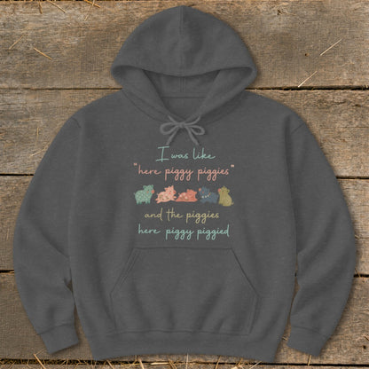 Dark grey hoodie with "I was like 'here piggy piggies' and the piggies here piggy piggied" and cartoon pigs.
