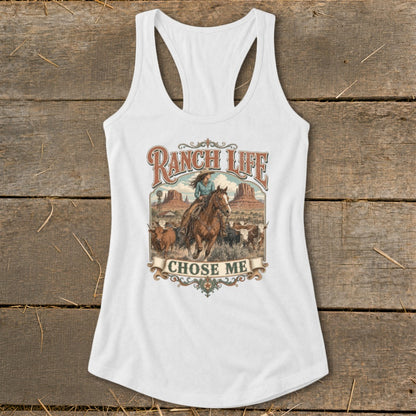 White tank top with "Ranch Life Chose Me" graphic of a woman on a horse with cattle.