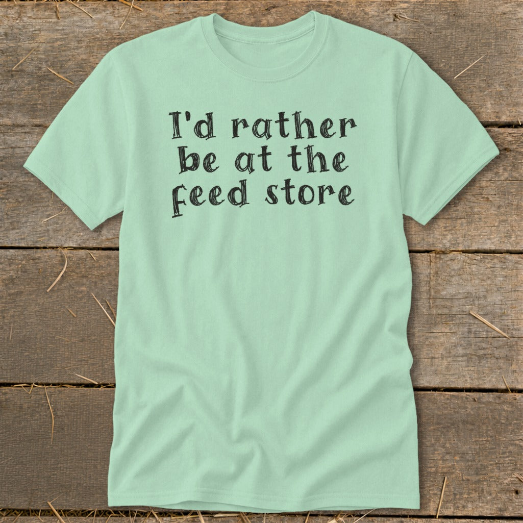 Light mint t-shirt with black text "I'd rather be at the feed store".