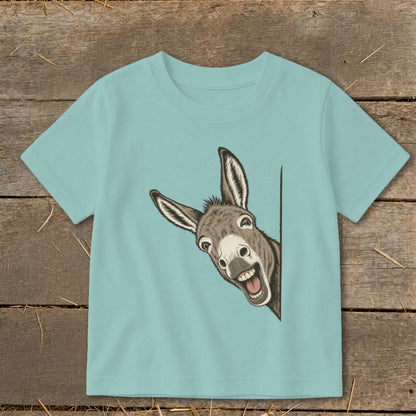Light blue t-shirt with a smiling donkey peeking from the side.