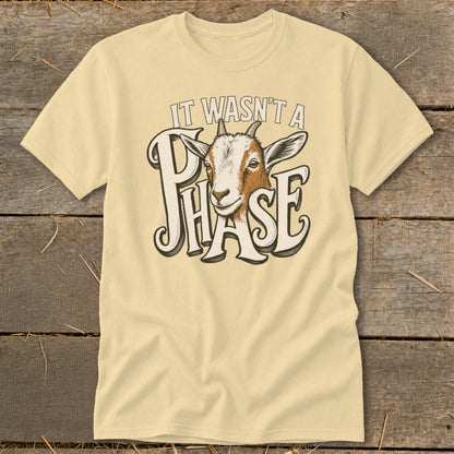 Light yellow t-shirt with goat head graphic and text "It Wasn't a Phase".