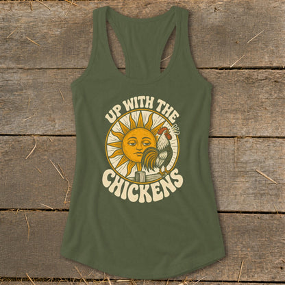 An olive green racerback tank top featuring a graphic of a crowing rooster and sun with the text Up With The Chickens.