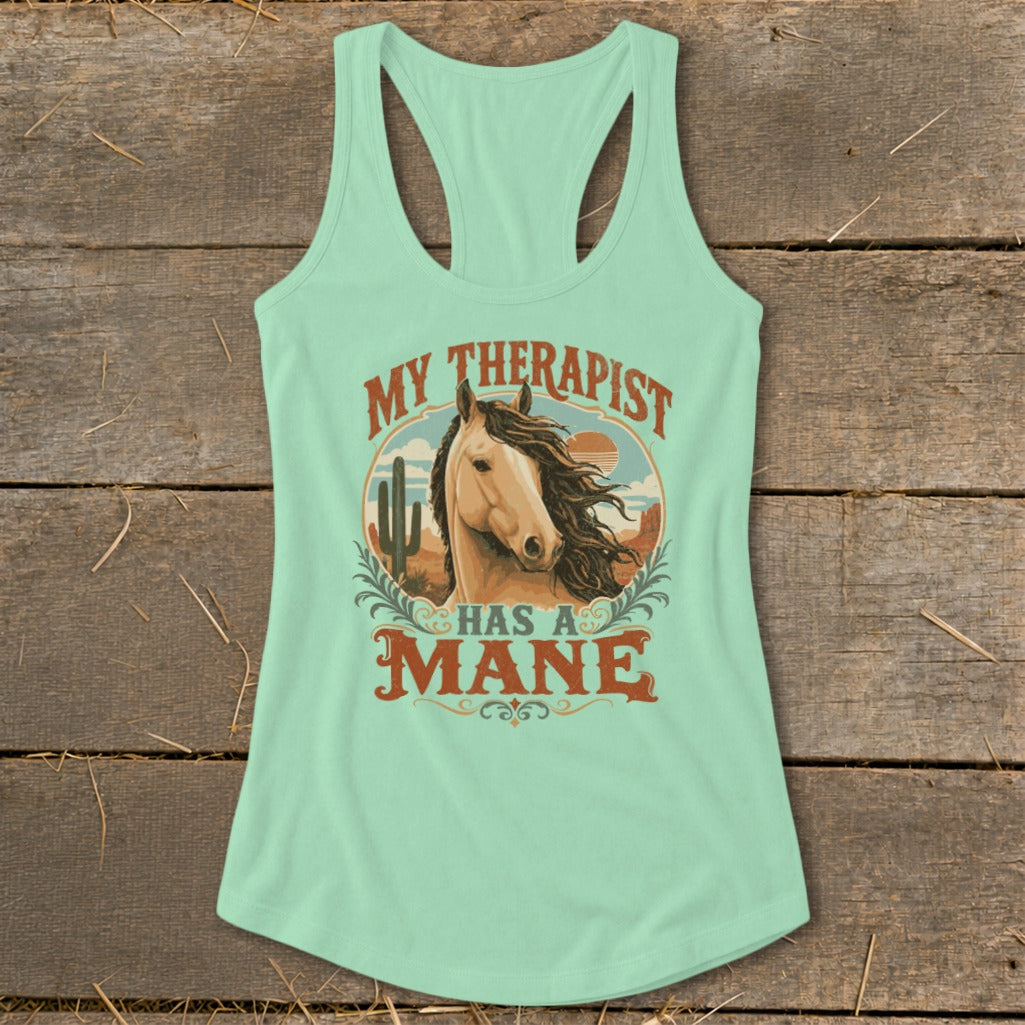 Light blue tank top with a horse and desert graphic and text "MY THERAPIST HAS A MANE".