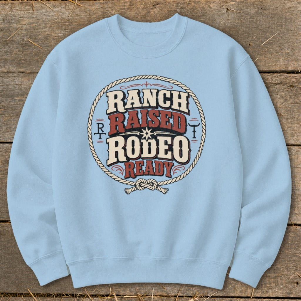 Light blue sweatshirt with "Ranch Raised Rodeo Ready" text inside a rope circle.