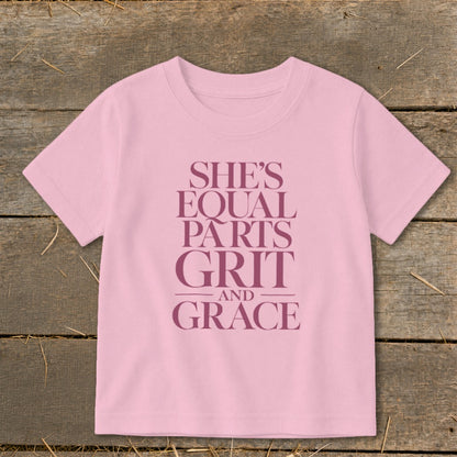 Pink t-shirt with text "She's Equal Parts Grit And Grace."