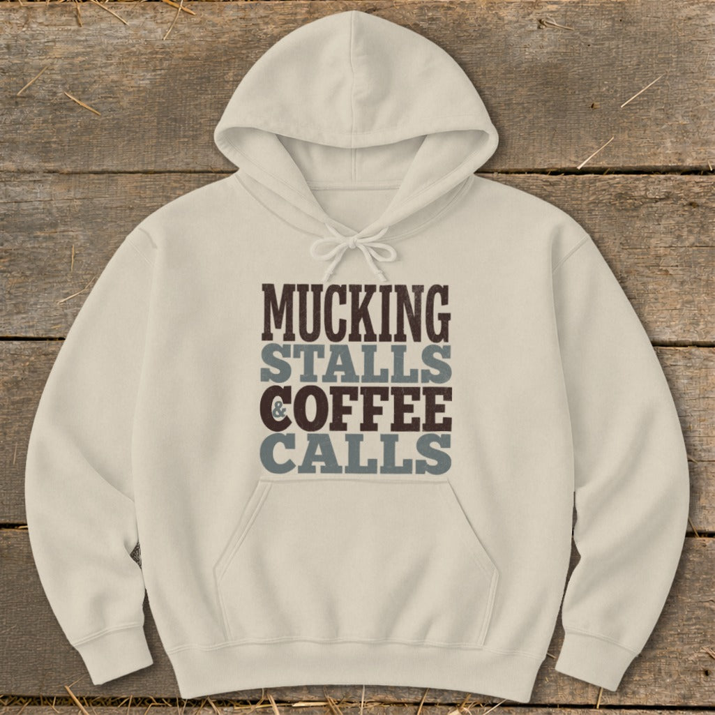 Cream hoodie with "Mucking Stalls & Coffee Calls" text graphic.
