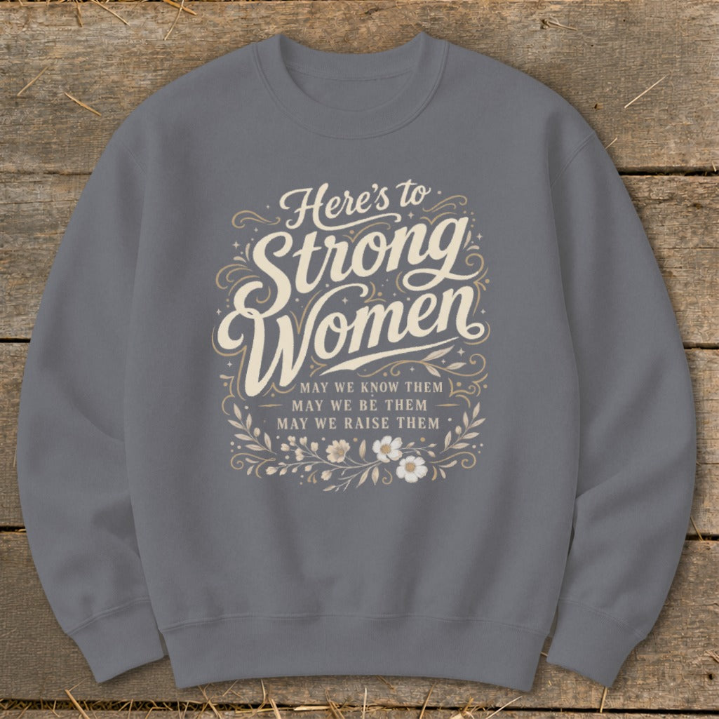 Grey sweatshirt with "Here's to Strong Women" and floral design.